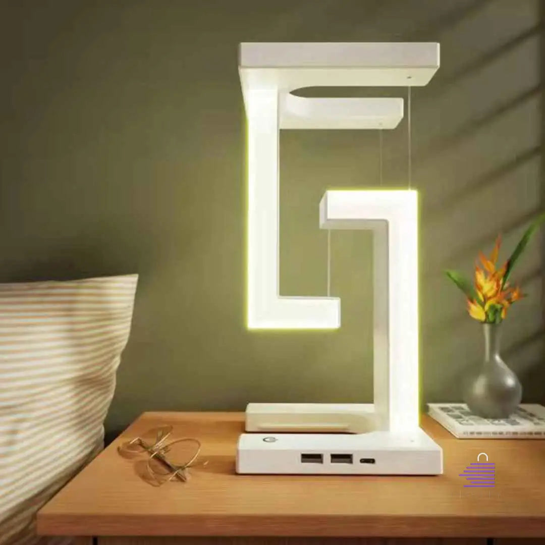 A Martify LED Suspended Anti-gravity Night Light with 10W Wireless Charger Desk Lamp Dimmable LED Table Lamp For Bedroom Bedside Decor on it.