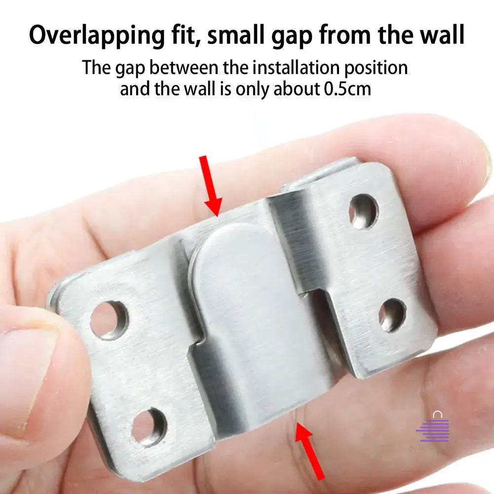A person is holding a Martify WallArtMate with a small gap between it and the wall.